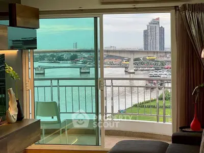 Stunning river view from modern apartment balcony with stylish interior.