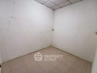 Small empty room with tiled floor and plain white walls, ideal for storage or utility use.