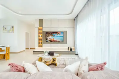 Luxurious modern living room with elegant decor and large windows