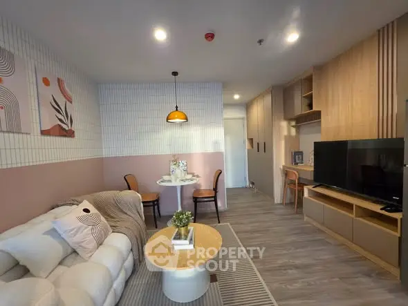 Modern living room with stylish decor and cozy seating area, perfect for relaxation and entertainment.