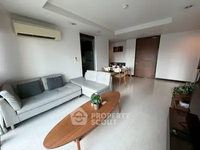 Spacious modern living room with sleek furniture and natural light