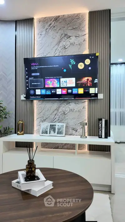 Modern living room with stylish TV setup and elegant decor