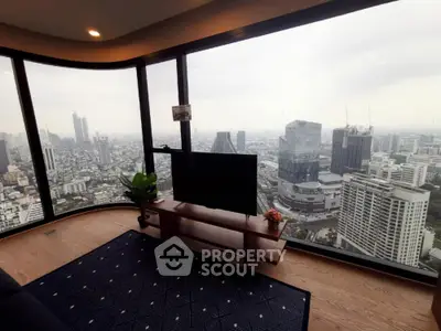 Luxurious living room with panoramic city view from high-rise apartment