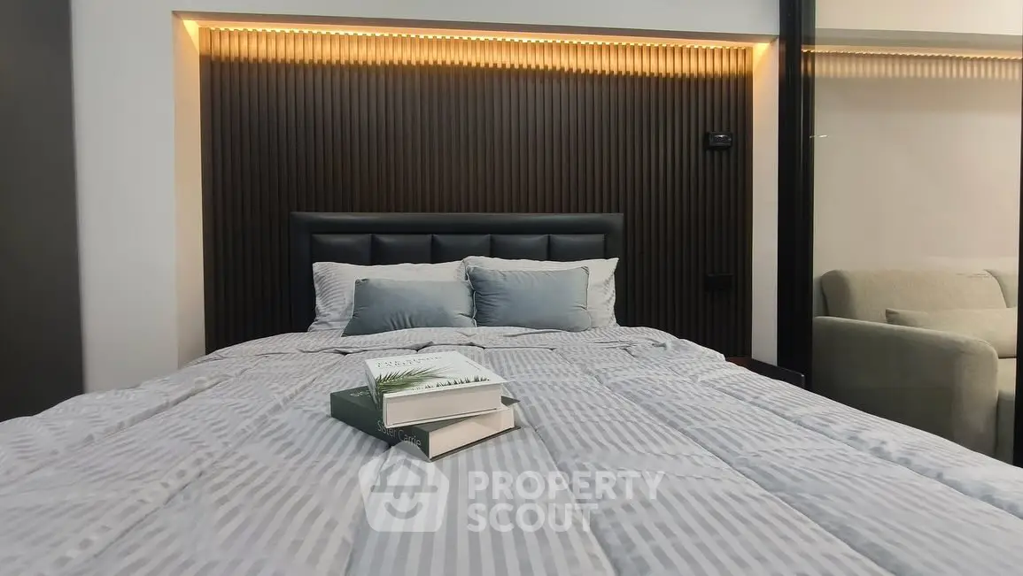 Modern bedroom with stylish headboard and cozy bedding