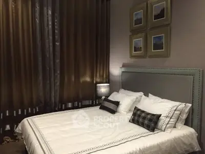 Luxurious bedroom with elegant decor and plush bedding in a modern apartment.