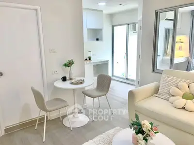 Charming modern living room with cozy dining area and bright natural light