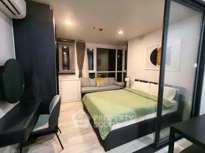 Modern bedroom with stylish decor and large window for natural light