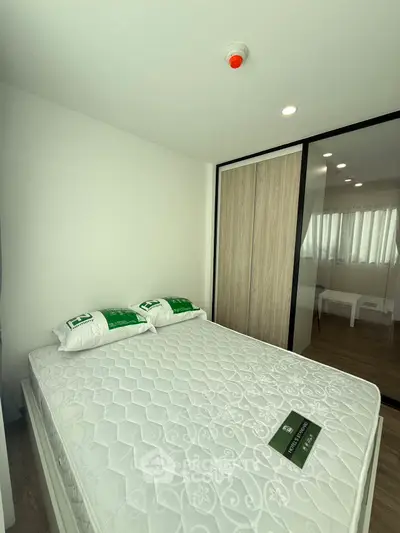 Modern bedroom with minimalist design and ample natural light