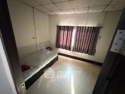 Cozy bedroom with natural light and minimalist decor