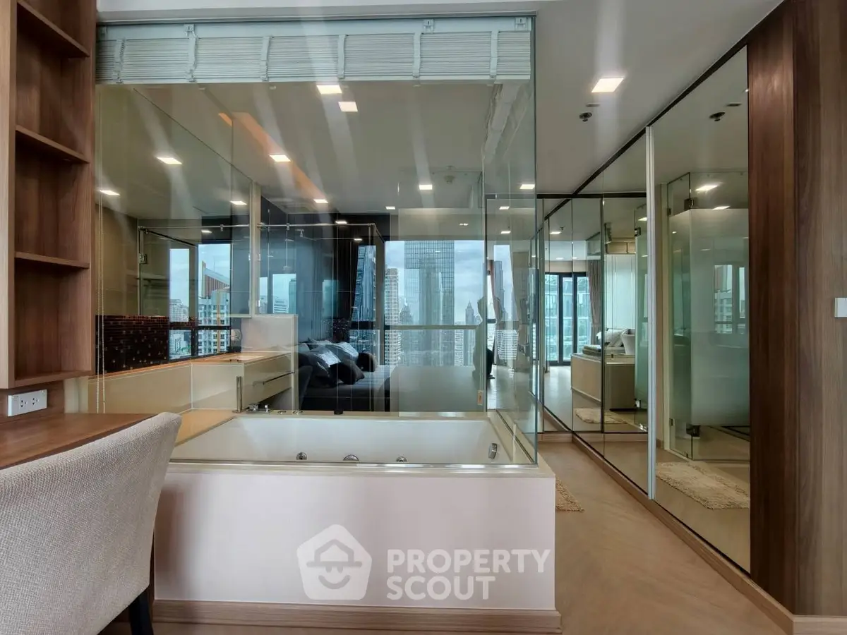 Luxurious modern apartment with glass walls and city view, featuring a built-in bathtub and elegant decor.