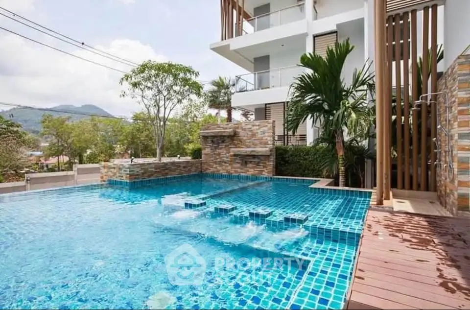 Luxurious modern apartment with stunning outdoor pool and scenic mountain views.