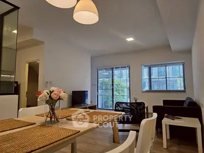 Modern living room with stylish decor and ample natural light