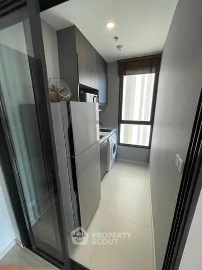 Modern kitchen with sleek appliances and natural light