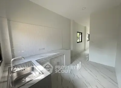 Modern kitchen with sleek design and ample natural light