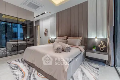 Luxurious modern bedroom with elegant decor and floor-to-ceiling windows