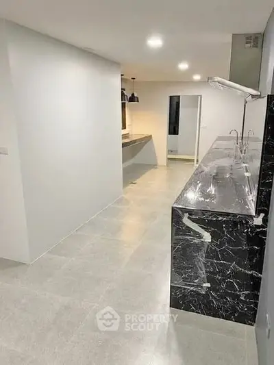 Modern kitchen with sleek marble countertops and open layout design