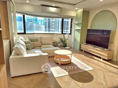 Spacious modern living room with large windows and stylish decor