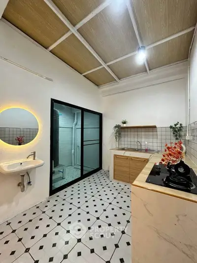 Modern kitchen with sleek design, featuring a gas stove and stylish backsplash, perfect for culinary enthusiasts.
