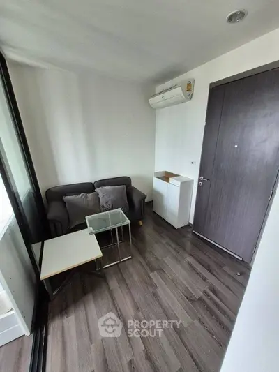 Cozy small living room with modern furniture and air conditioning