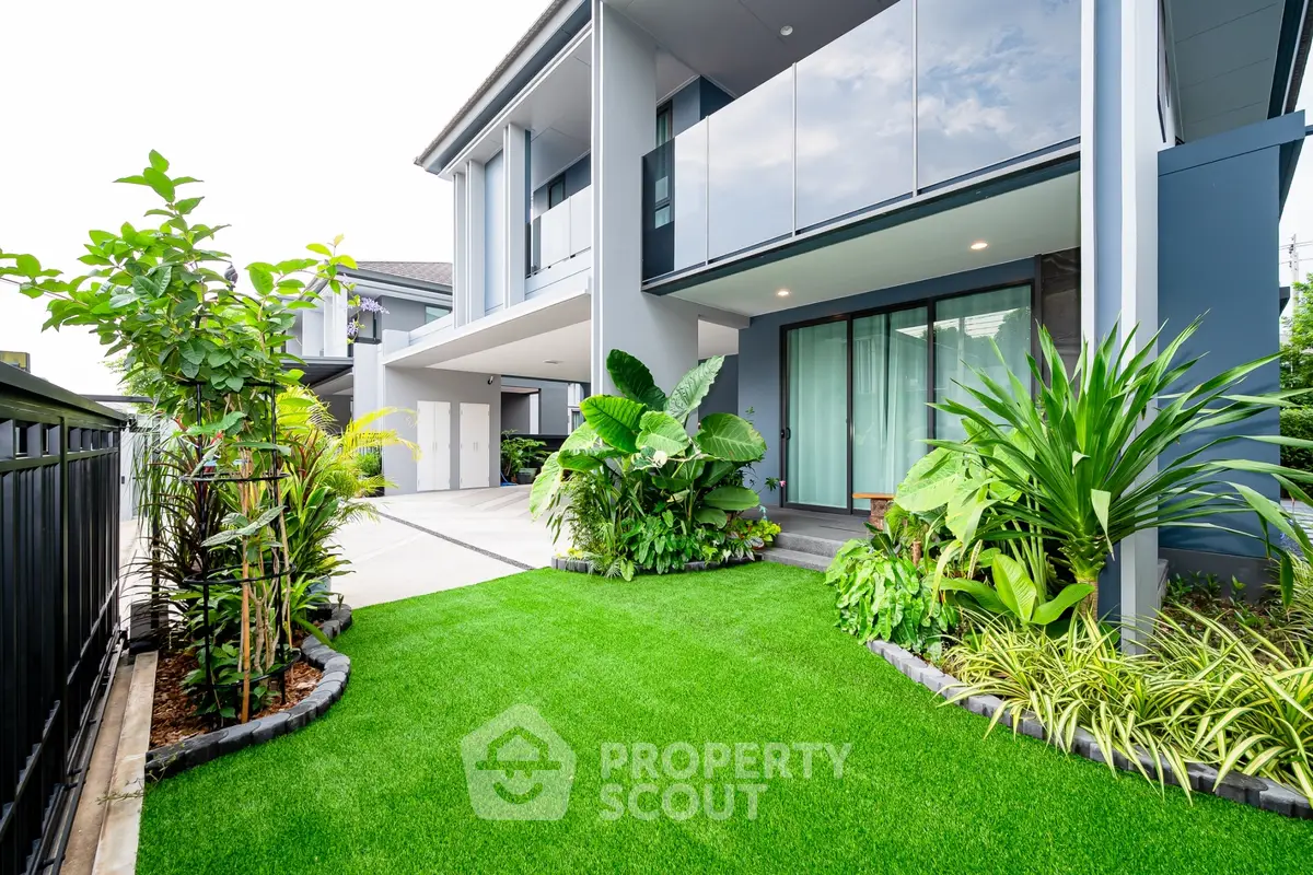 Modern home exterior with lush garden and sleek architecture