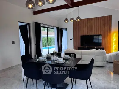 Luxurious modern living room with elegant dining area and pool view