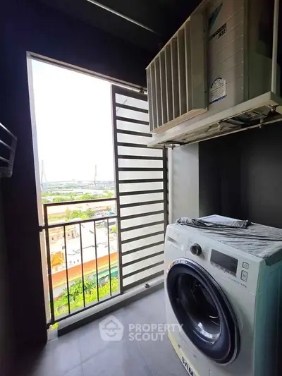 Modern laundry area with washing machine and scenic view from balcony