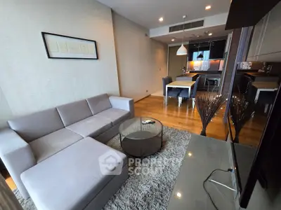 Modern living room with cozy sectional sofa and open kitchen layout