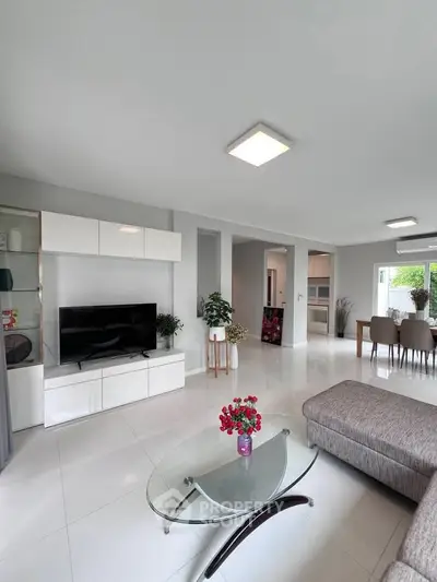 Spacious modern living room with sleek furniture and natural light