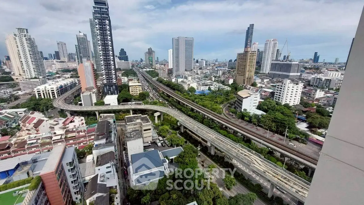 Stunning cityscape view with modern skyscrapers and elevated highways, perfect for urban living.
