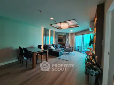 Spacious modern living room with elegant decor and large windows for natural light.