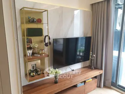 Modern living room with stylish TV setup and decorative shelving
