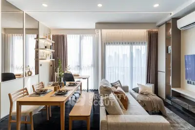 Modern living room with elegant dining area and city view, featuring stylish furniture and decor.