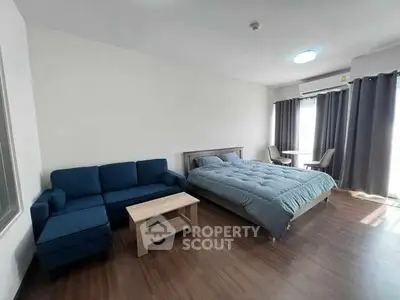 Spacious studio apartment with modern furnishings and natural light