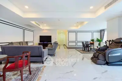 Spacious modern living room with elegant furniture and marble flooring, perfect for luxury living.