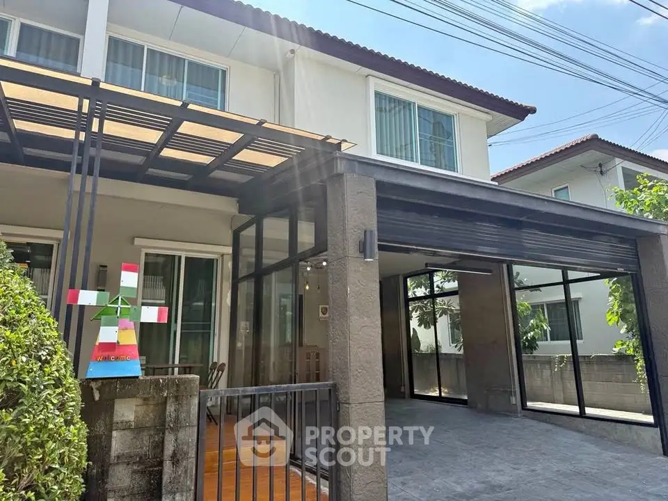 Charming two-story house with spacious garage and modern exterior design.