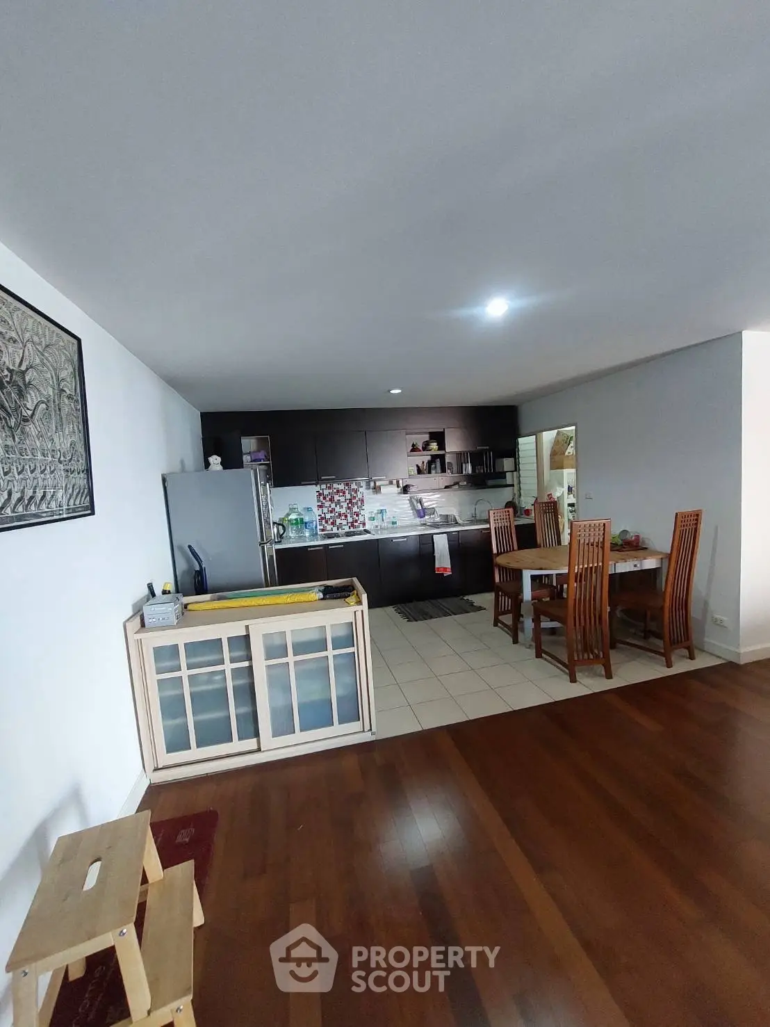 Spacious open-plan living area with modern kitchen and dining space