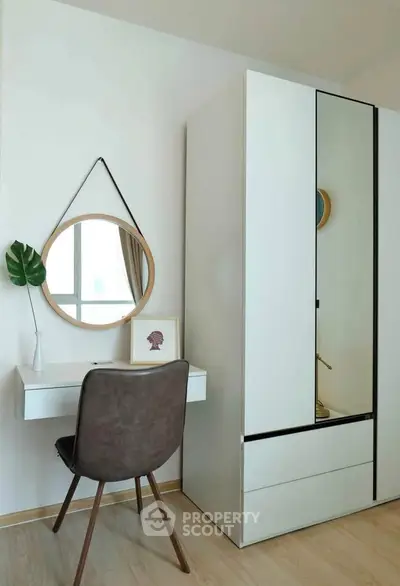 Modern minimalist bedroom with sleek wardrobe and stylish vanity desk