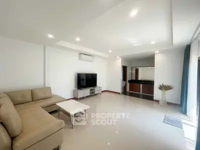 Spacious modern living room with sleek furniture and open layout
