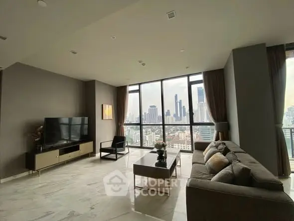 Luxurious living room with stunning city skyline view and modern furnishings.