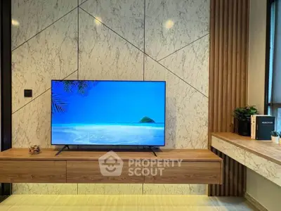 Modern living room with sleek TV and stylish wooden decor