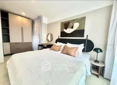 Modern bedroom with stylish decor and ample storage space