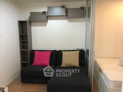 Cozy living room with modern shelving and comfortable sofa in stylish apartment