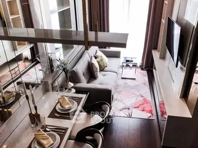 Modern living room with stylish decor and dining area in open layout apartment.