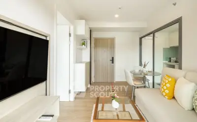 Modern living room with stylish decor and open kitchen layout in a contemporary apartment.