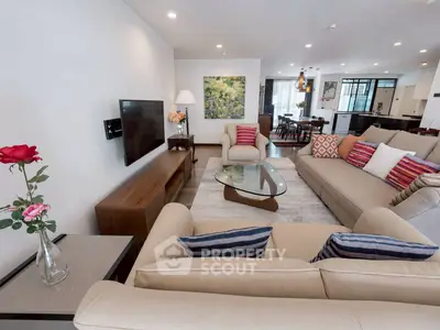 Spacious modern living room with elegant decor and open layout, perfect for entertaining.