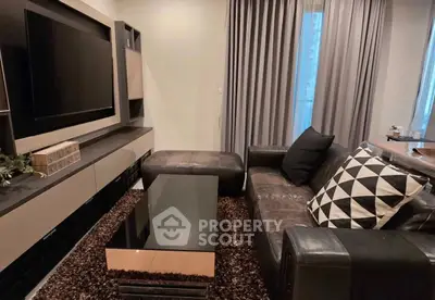 Stylish modern living room with sleek leather sofa and large TV