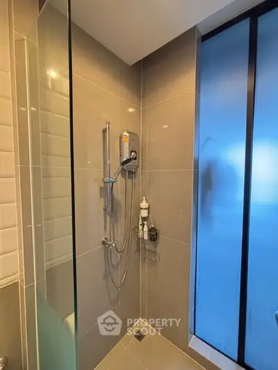 Modern bathroom with sleek shower and frosted glass door
