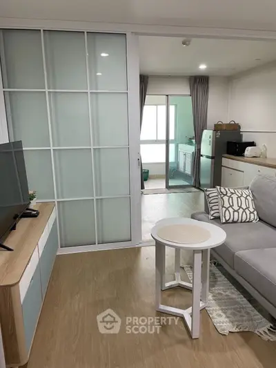 Modern living room with sliding glass doors and stylish furniture