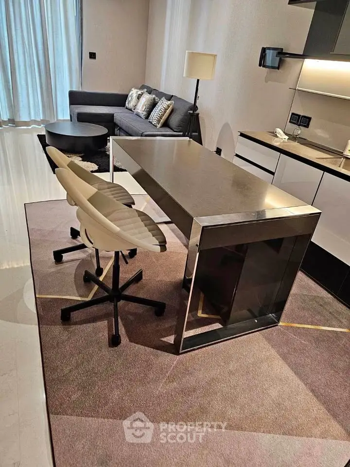 Modern living room with sleek furniture and stylish kitchen area