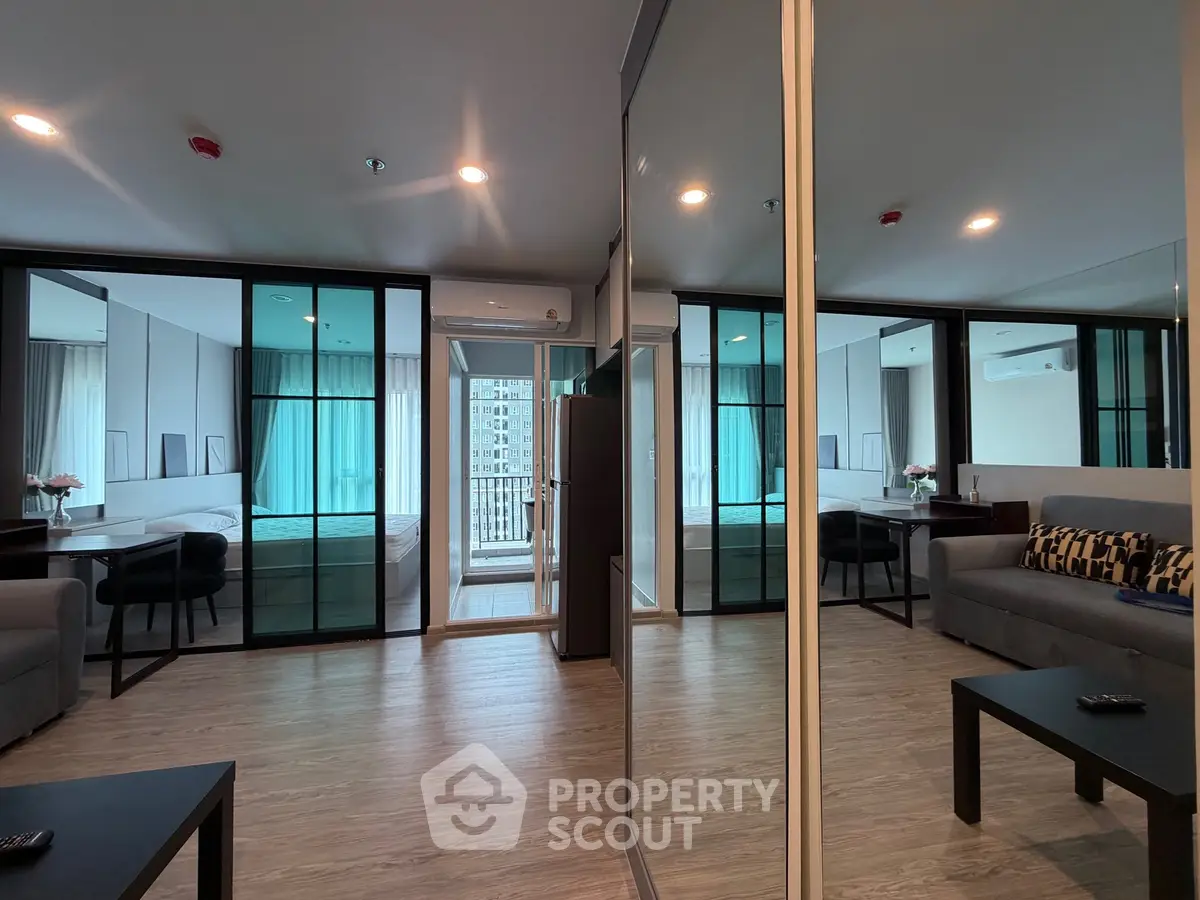 Modern living room with mirrored walls and city view balcony in luxury apartment